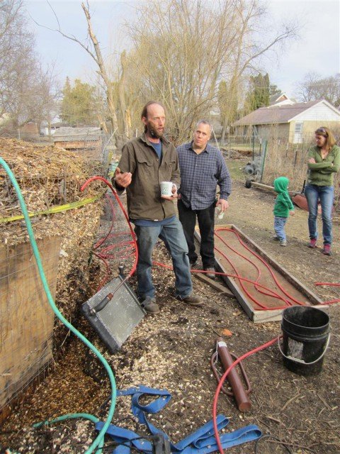 Explaining how the compost furnace will heat the greenhouse